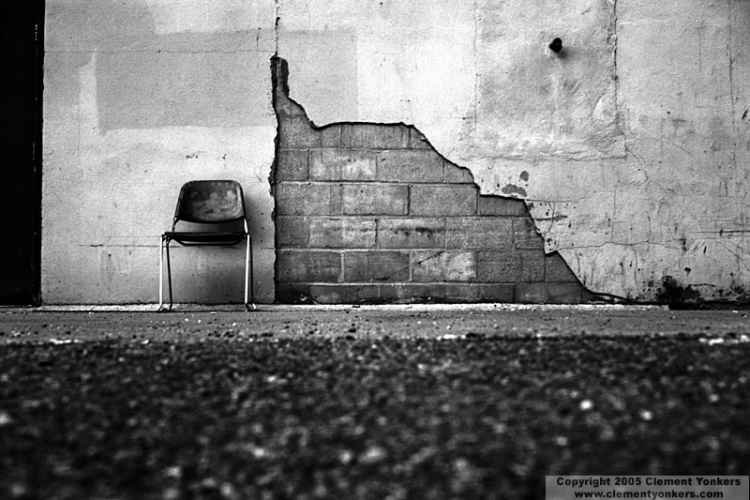 photo of chair against a wall B&W