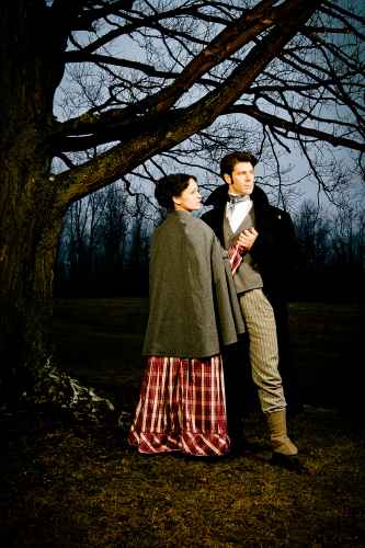 couple in period clothing under tree
