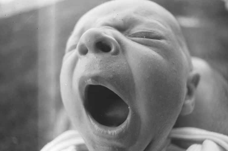 photo of infant yawing